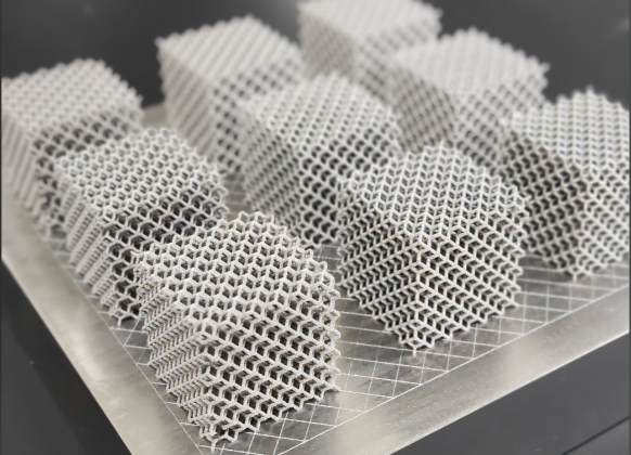 This is a 3D-printed part made of a titanium alloy.